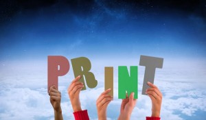 Hands showing print against white clouds under blue sky